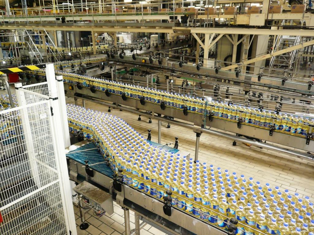 Convoyeur à chaînes inox pour produits unitaires en environnement industriel